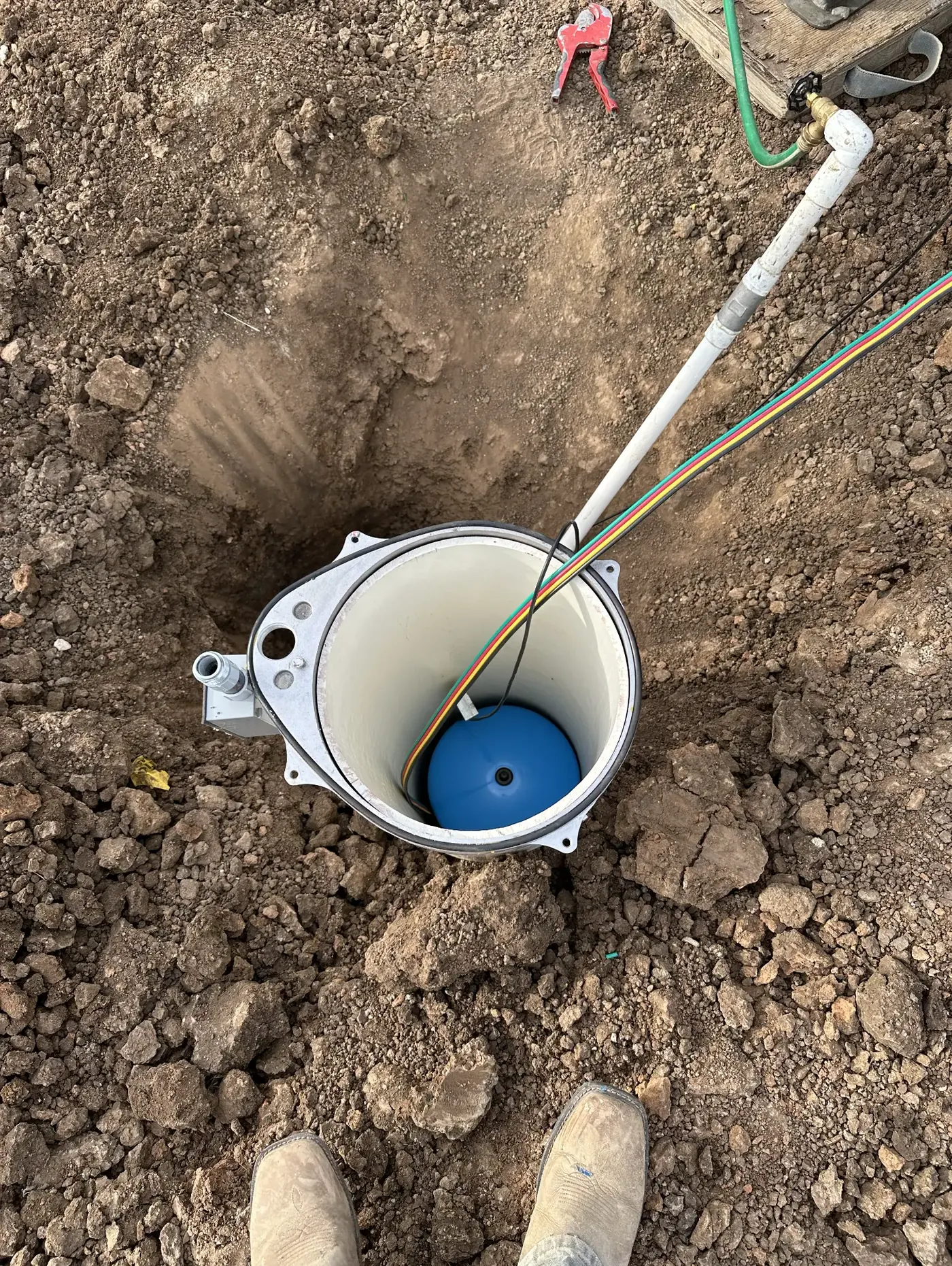 Chase Drilling LLC large commercial drilling rig fully extended and operating at a commercial job site in Kansas, drilling a high-capacity water well