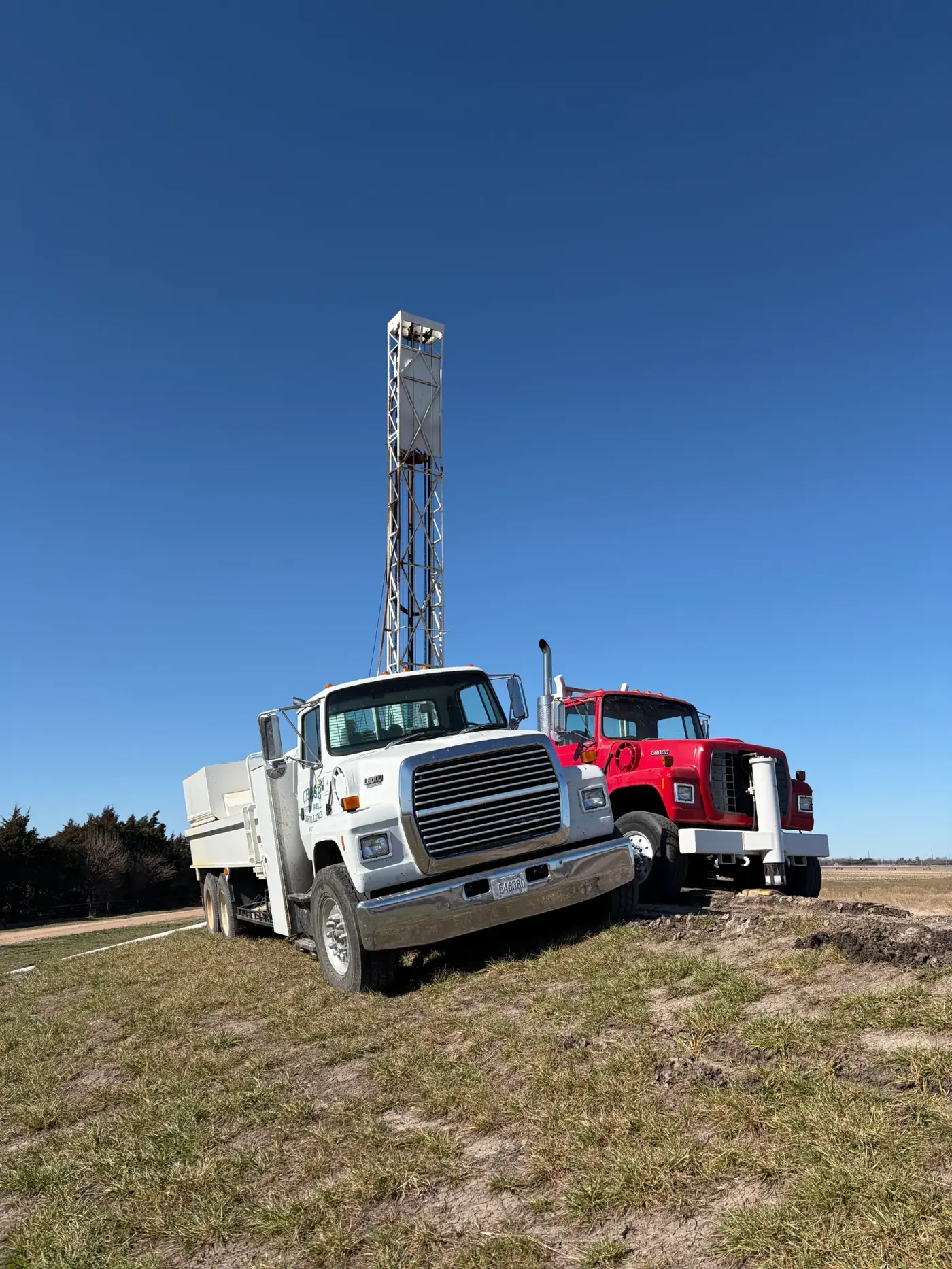 Chase Drilling LLC technician pulling a submersible well pump from a residential water well in Wichita, KS for inspection and repair